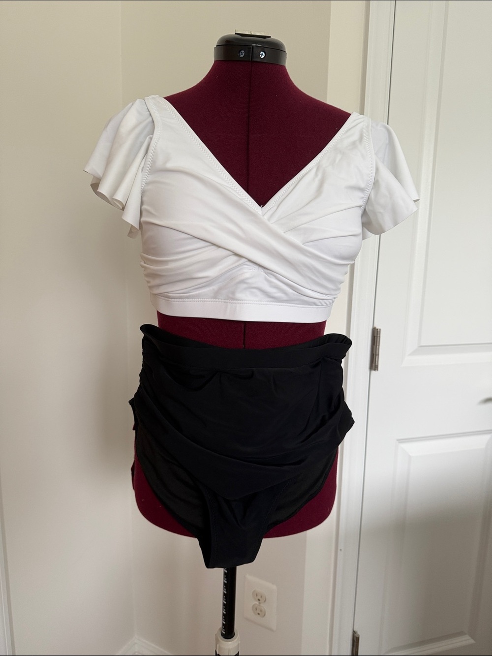 White V-Wrap Flutter Sleeve Crop Top with Black High-Waist Draped Bottoms